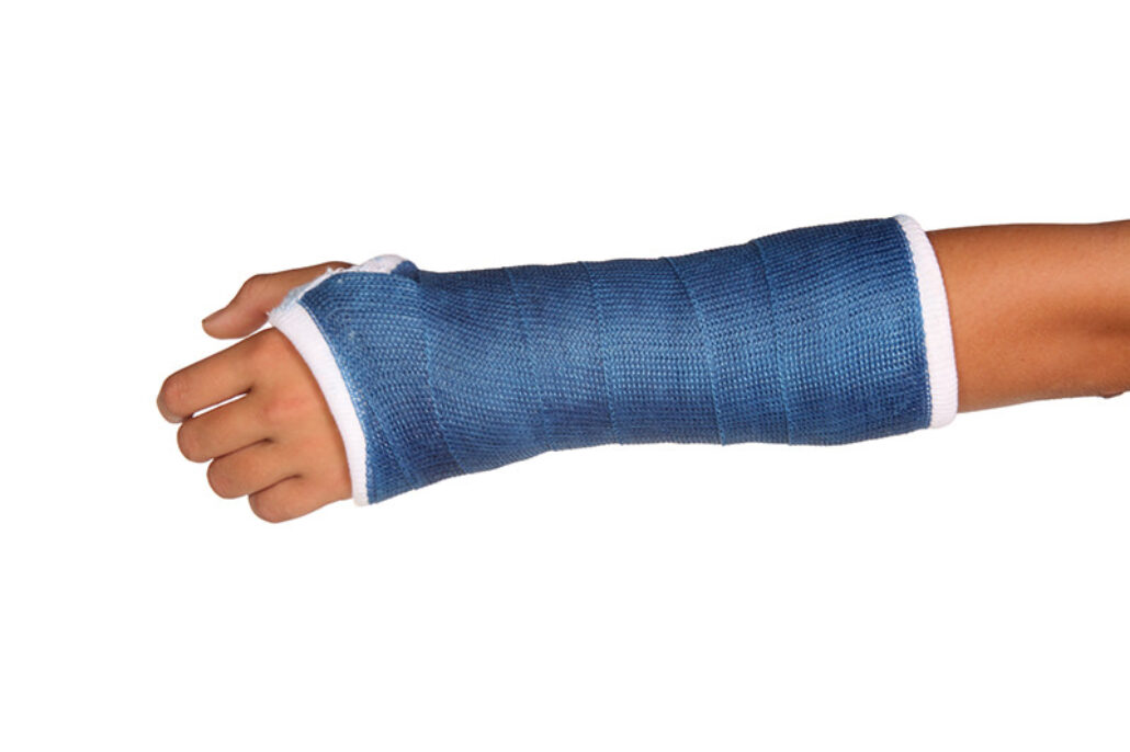 Close Broken Hand Cast Little Boy Standing Wall Stock Photo by