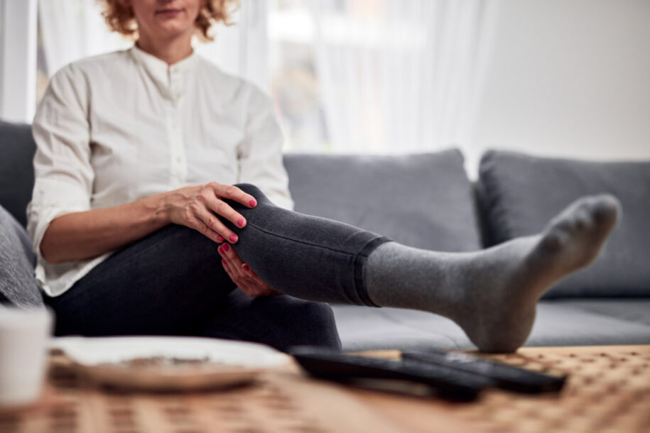 Woman holding her knee