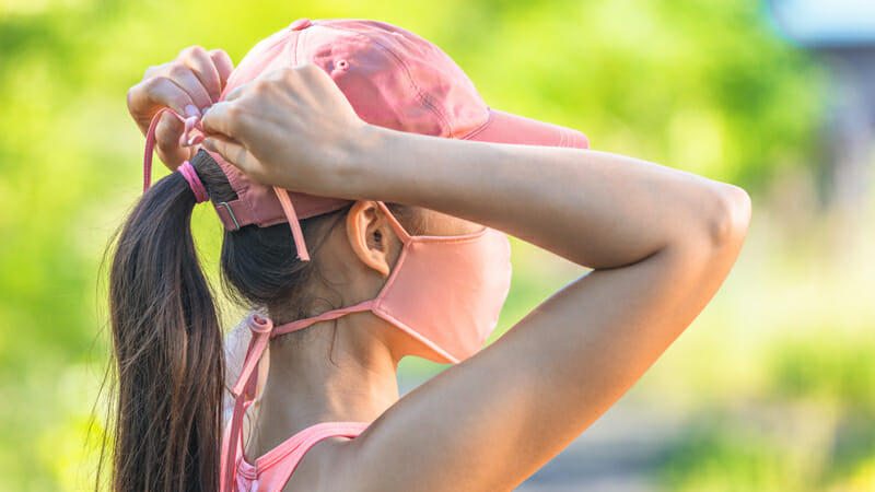 shutterstock 1763688224 athletic woman tying mask outdoors closeup profile blog