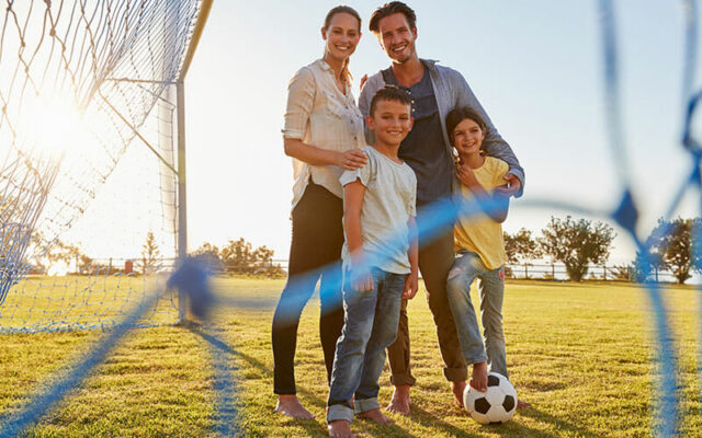 A family playing soccer together