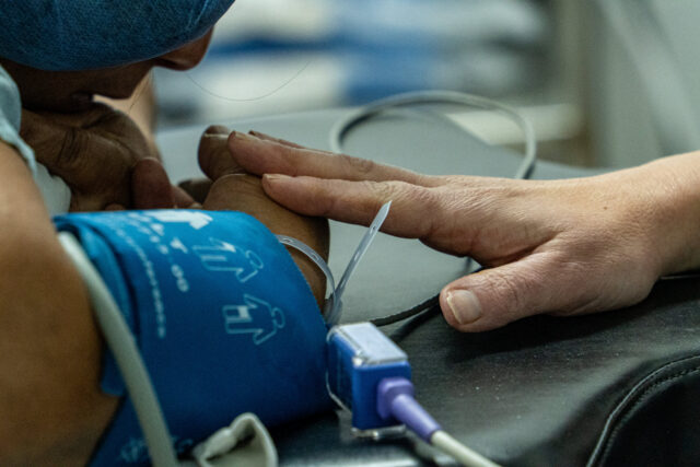 Women receiving care in Honduras One World Surgery Clinic with Summit Orthopedics employees