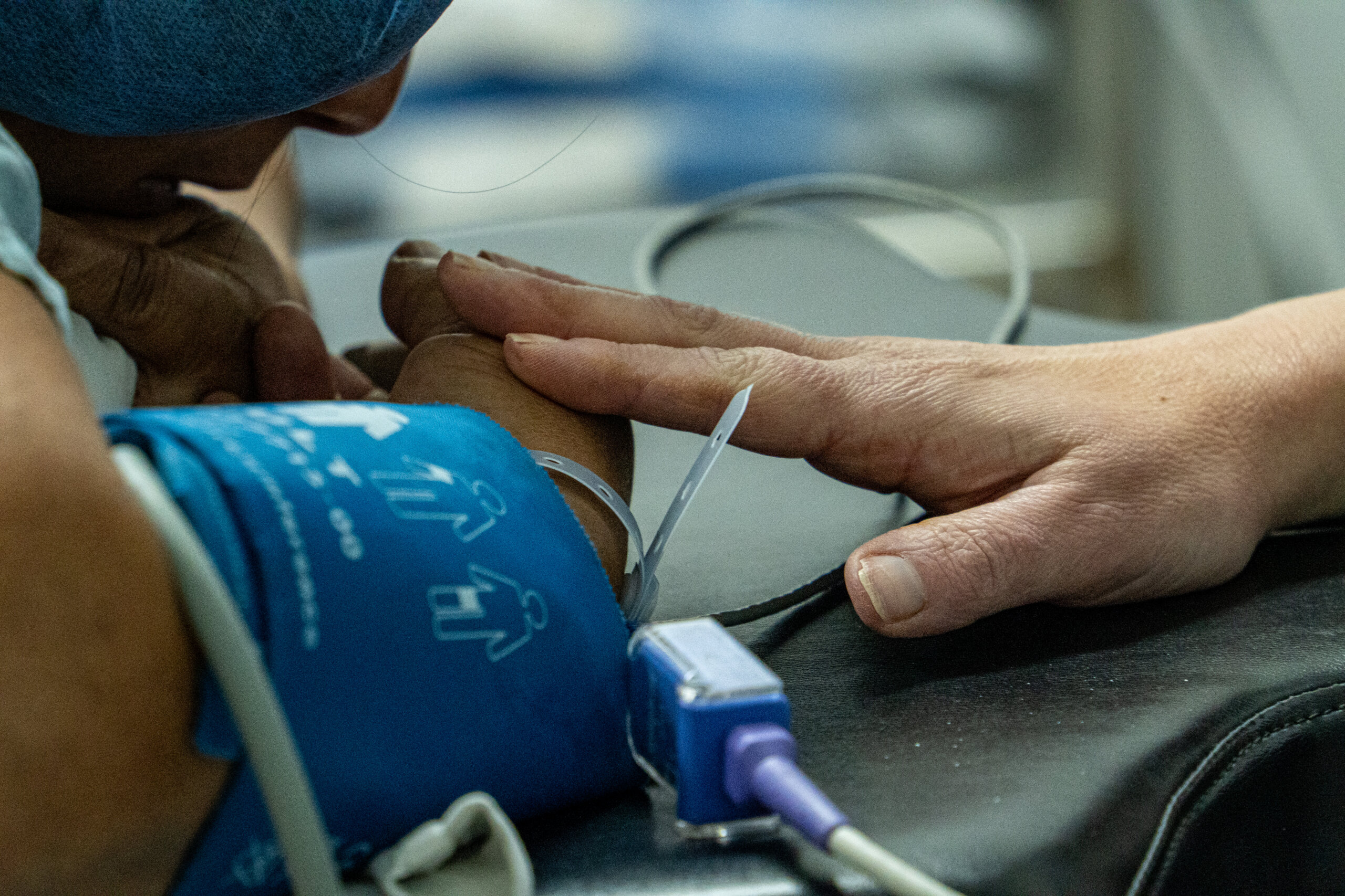 Women receiving care in Honduras One World Surgery Clinic with Summit Orthopedics employees