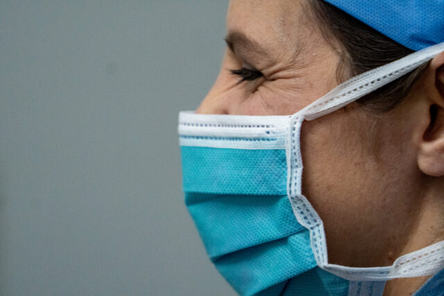 Someone smiling under their surgical mask. Enjoying their summit orthopedics careers.