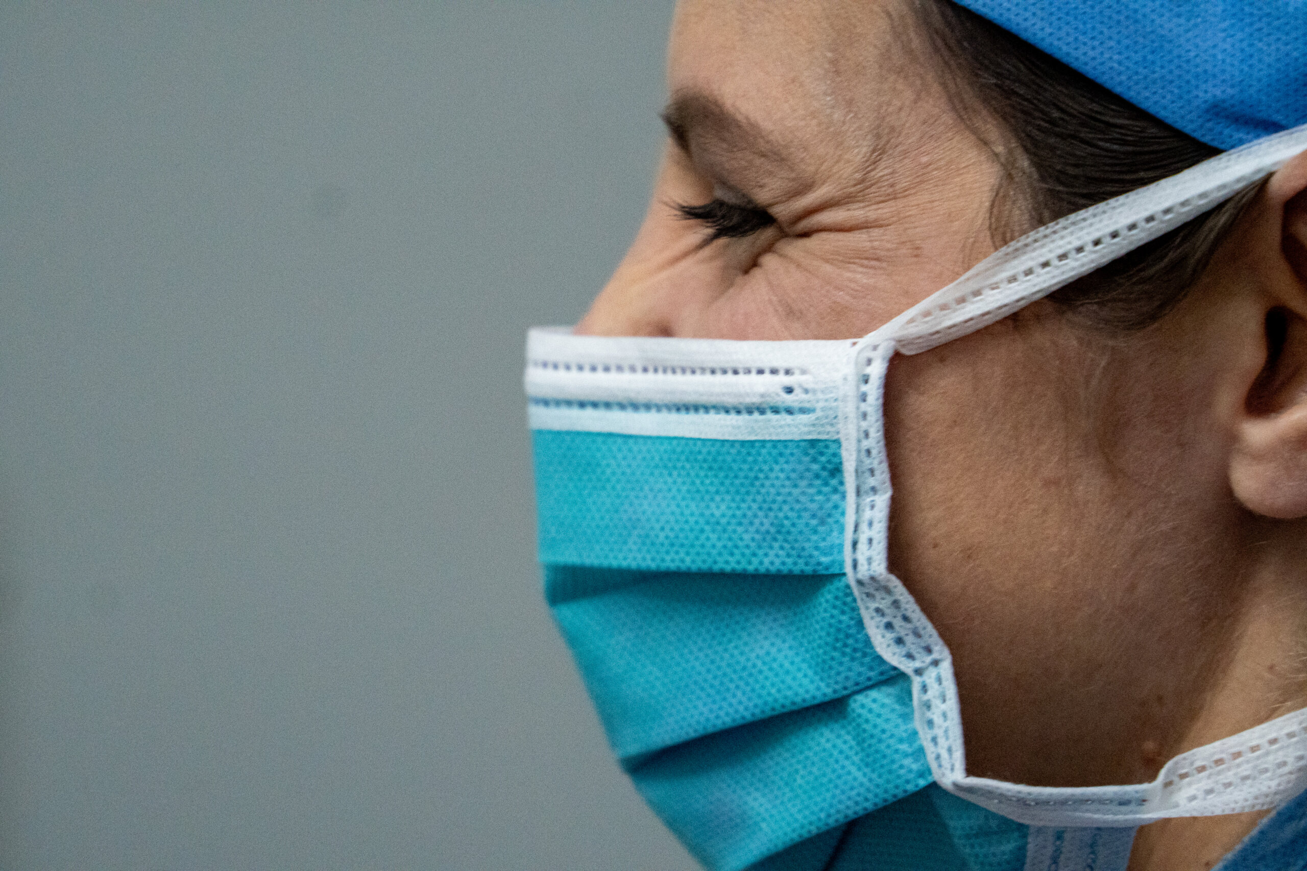 Someone smiling under their surgical mask. Enjoying their summit orthopedics careers.